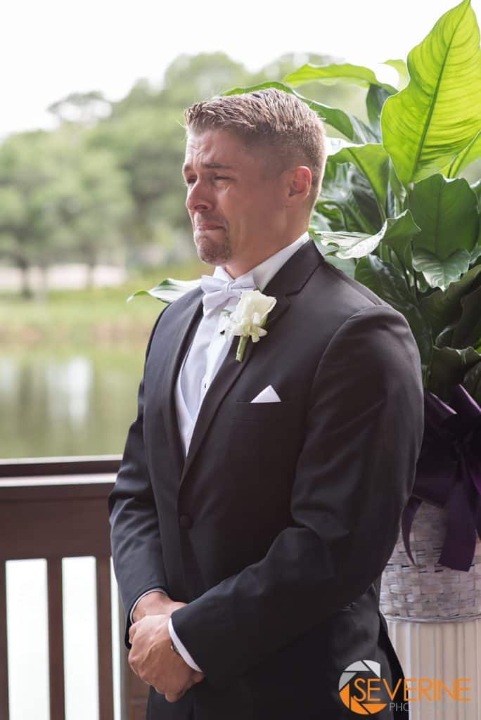 groom crying seeing the bride